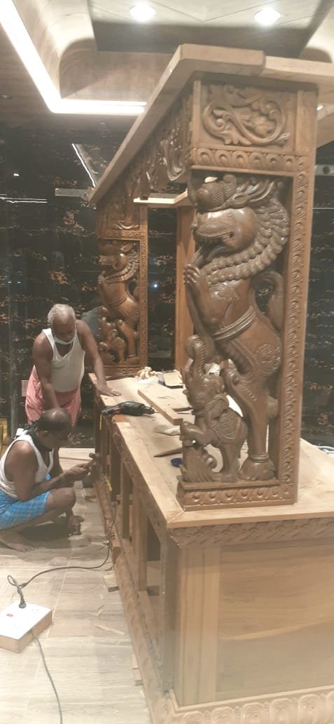 Carved lion pillar reception counter, finished commercial installation