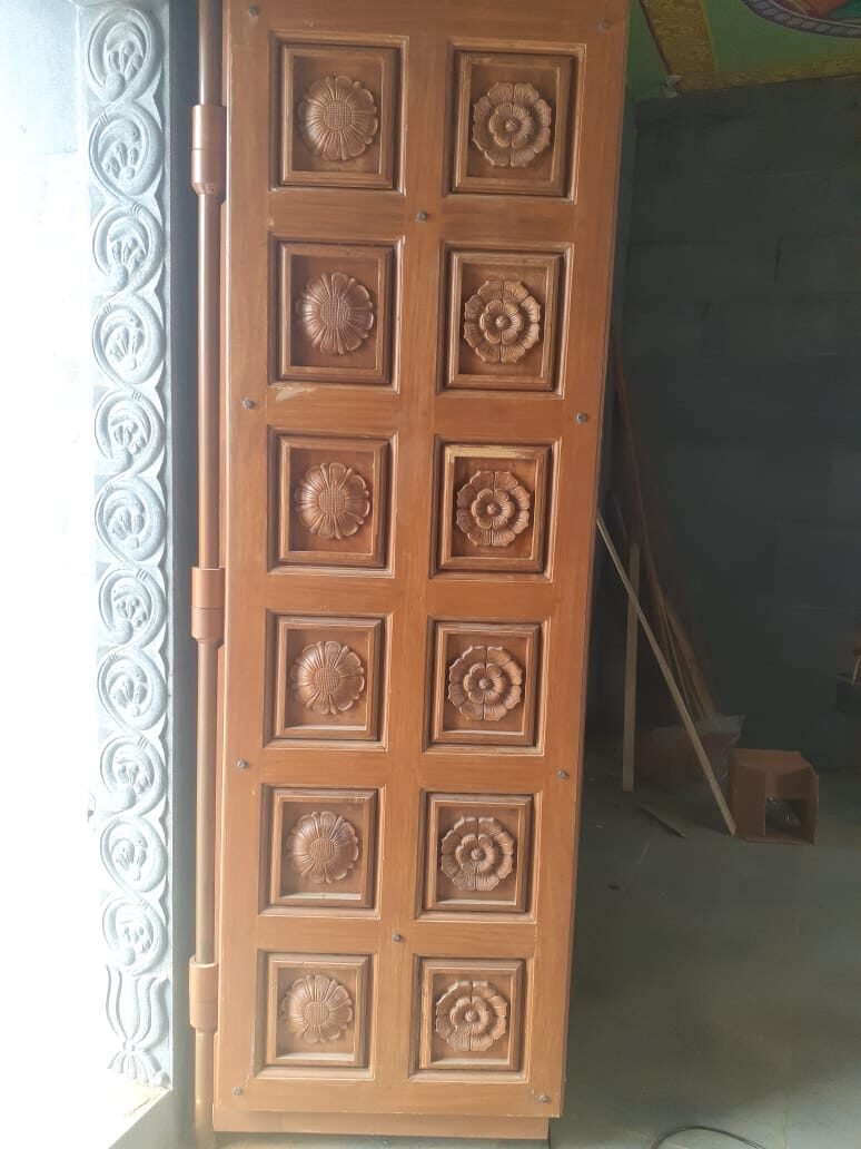 Tall carved wooden door