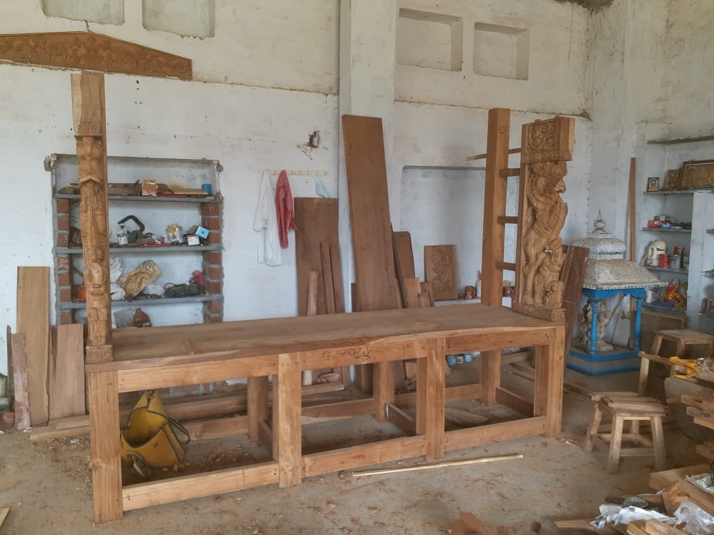 Carved pillar and workbench in the VA WoodArts workshop
