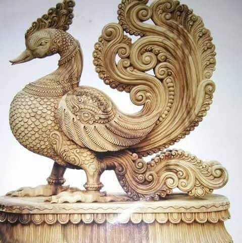Colourful painted elephant and bird sculpture
